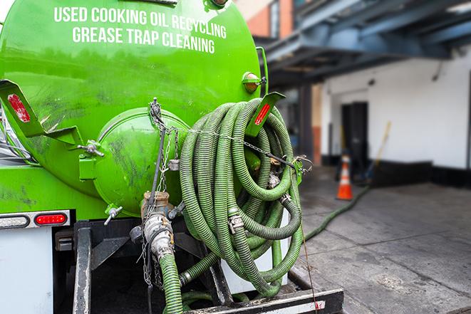 grease trap pumping truck servicing a restaurant in Buna TX